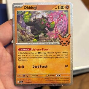 Pokemon Okidogi Card with Orange and Black Design